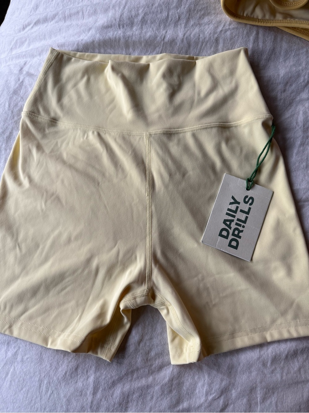Daily Drills Go! Shortie Shorts - Butter with Tonal Patch Medium NWT.